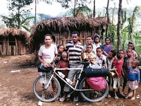 Villagers surrounding my bicycle in PNG