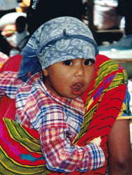 9 Guatemalan child getting a ride through the market place 800